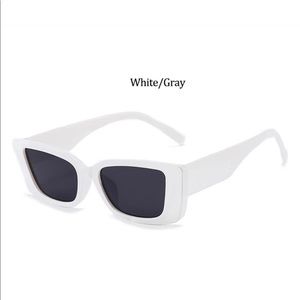 White frame with dark shades. Cat eye glasses